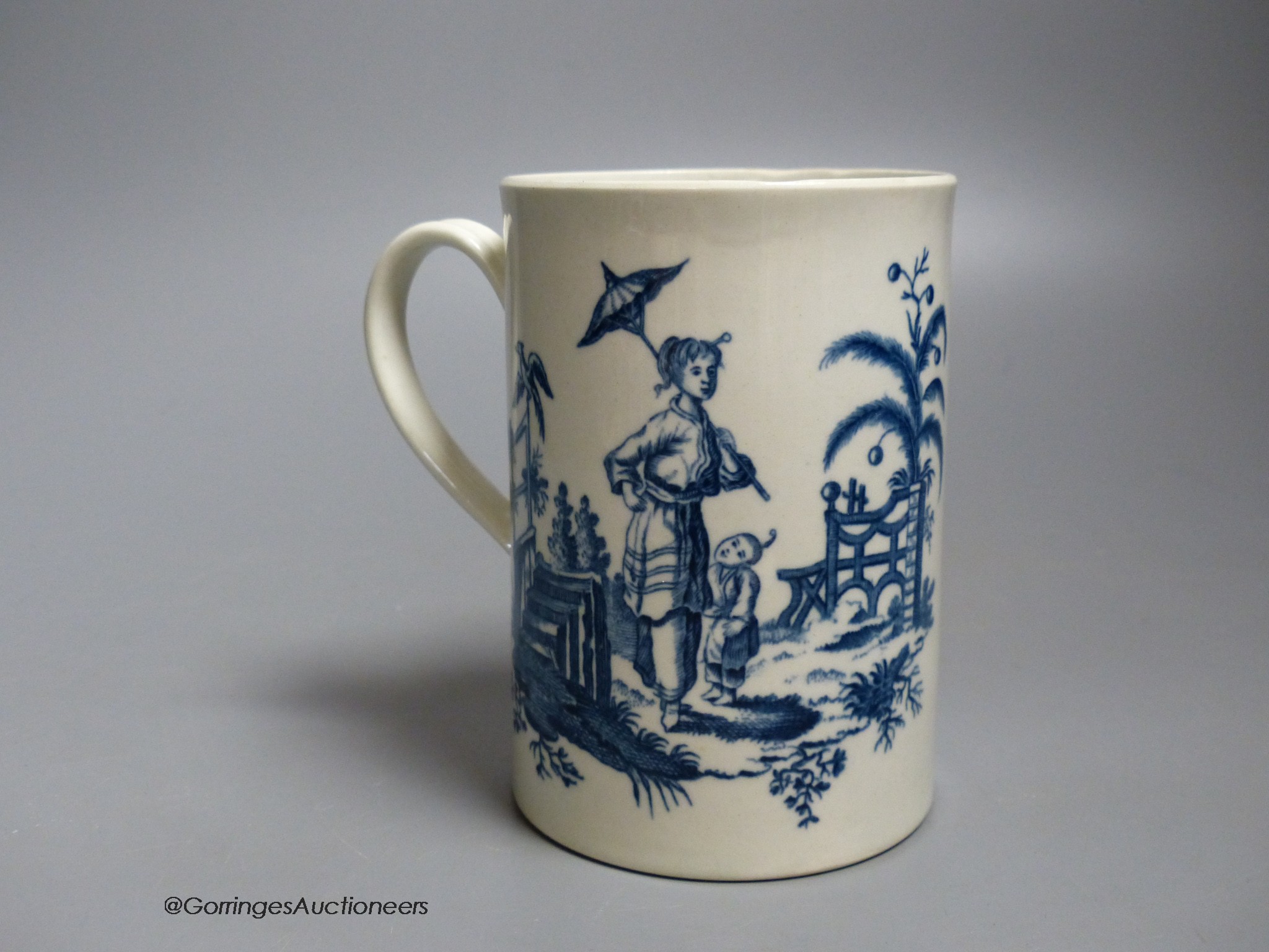 A Worcester 'La Peche and La Promenade Chinoise' pattern cylinder mug, printed in underglaze blue, shaded crescent mark, height 12cm